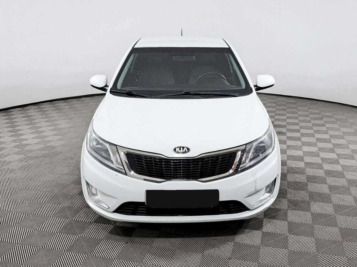 Kia Rio с пробегом — 2013 год. Фото: #1
