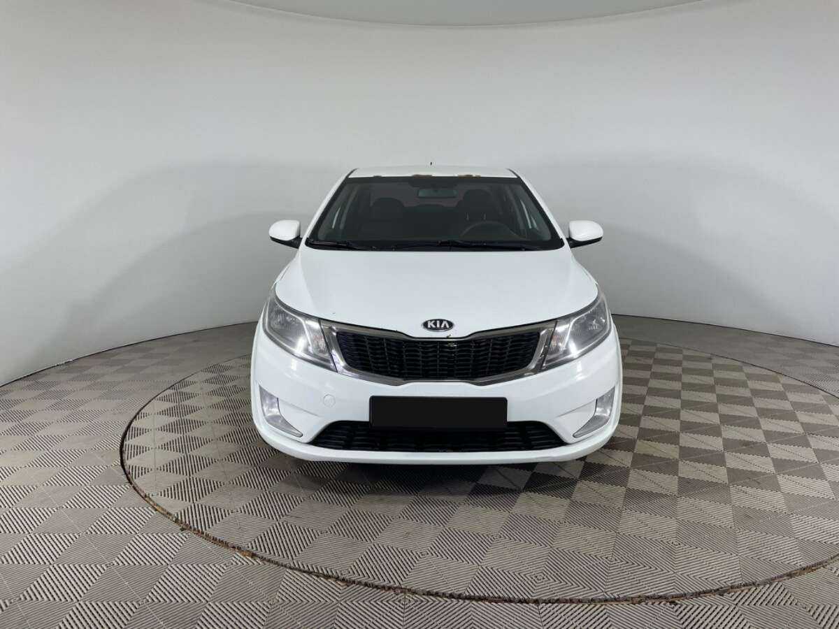 Kia Rio с пробегом — 2013 год. Фото: #1