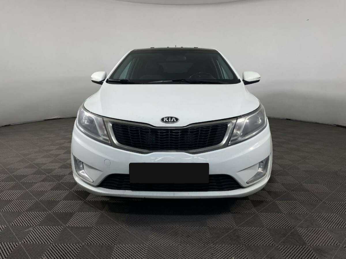 Kia Rio с пробегом — 2013 год. Фото: #1